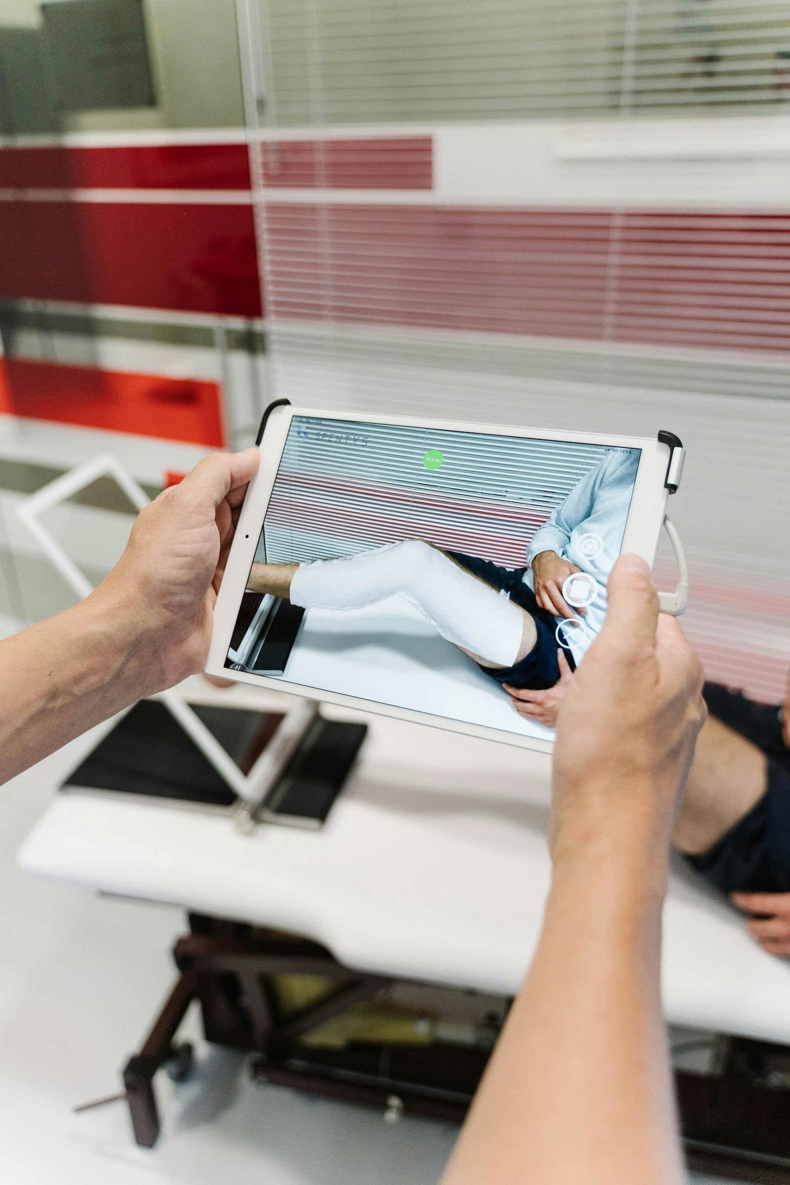 Medical professional using a tablet in a clinical environment