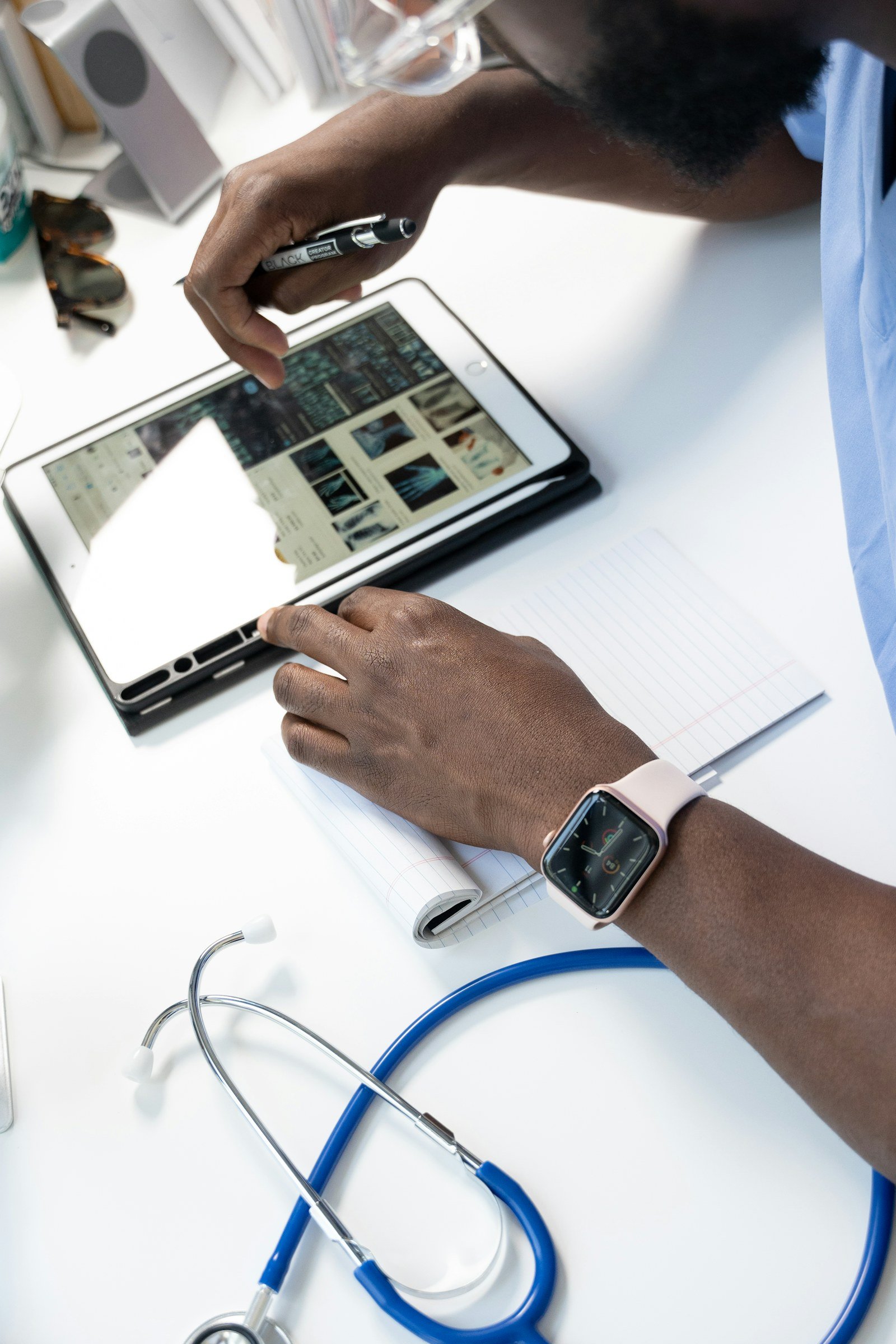 Healthcare professional reviewing digital information on a tablet