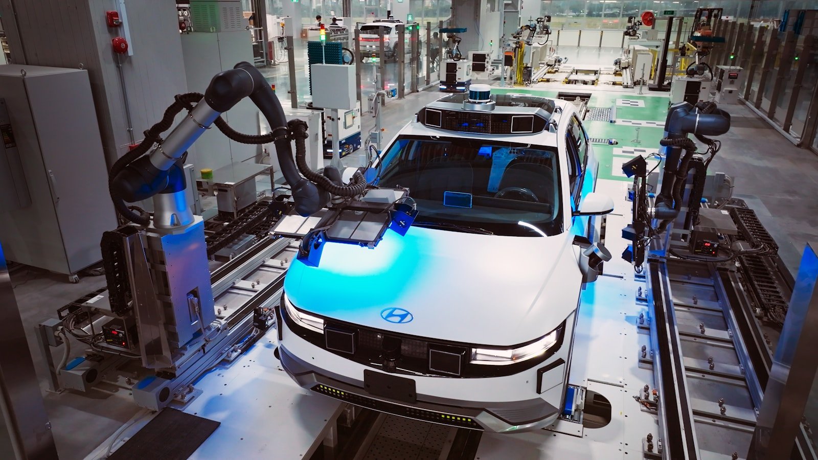 Robotic arms working on a modern automotive production line