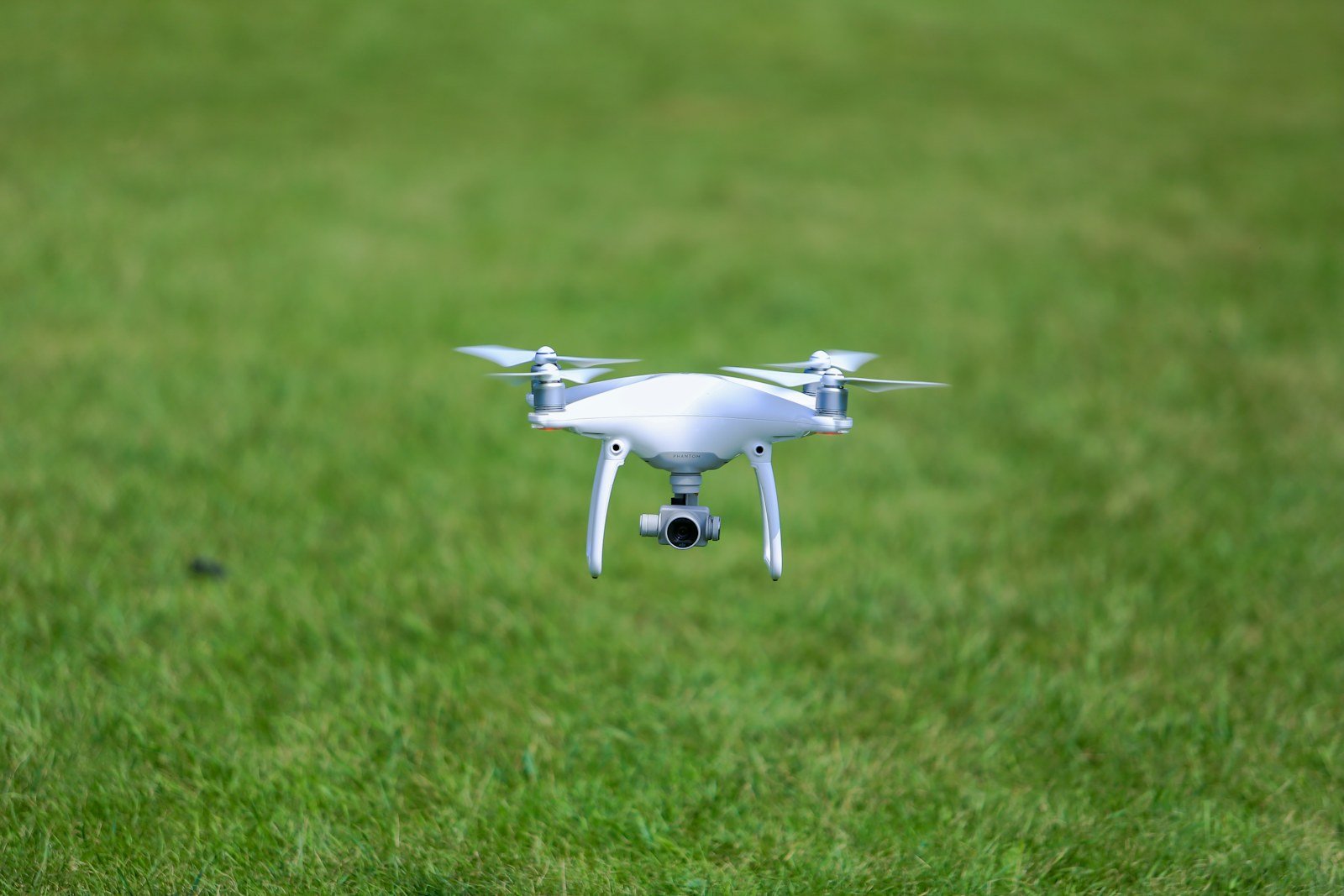 Drone monitoring a green agricultural field